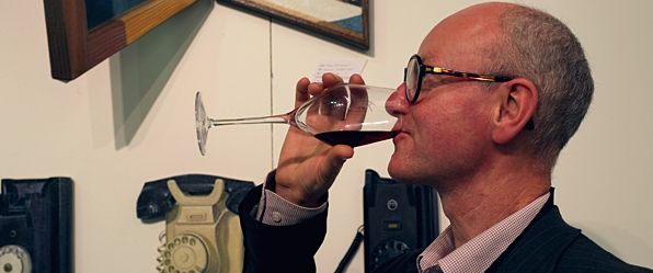 Artist Paul Critchely Enjoying a Drop of Wine